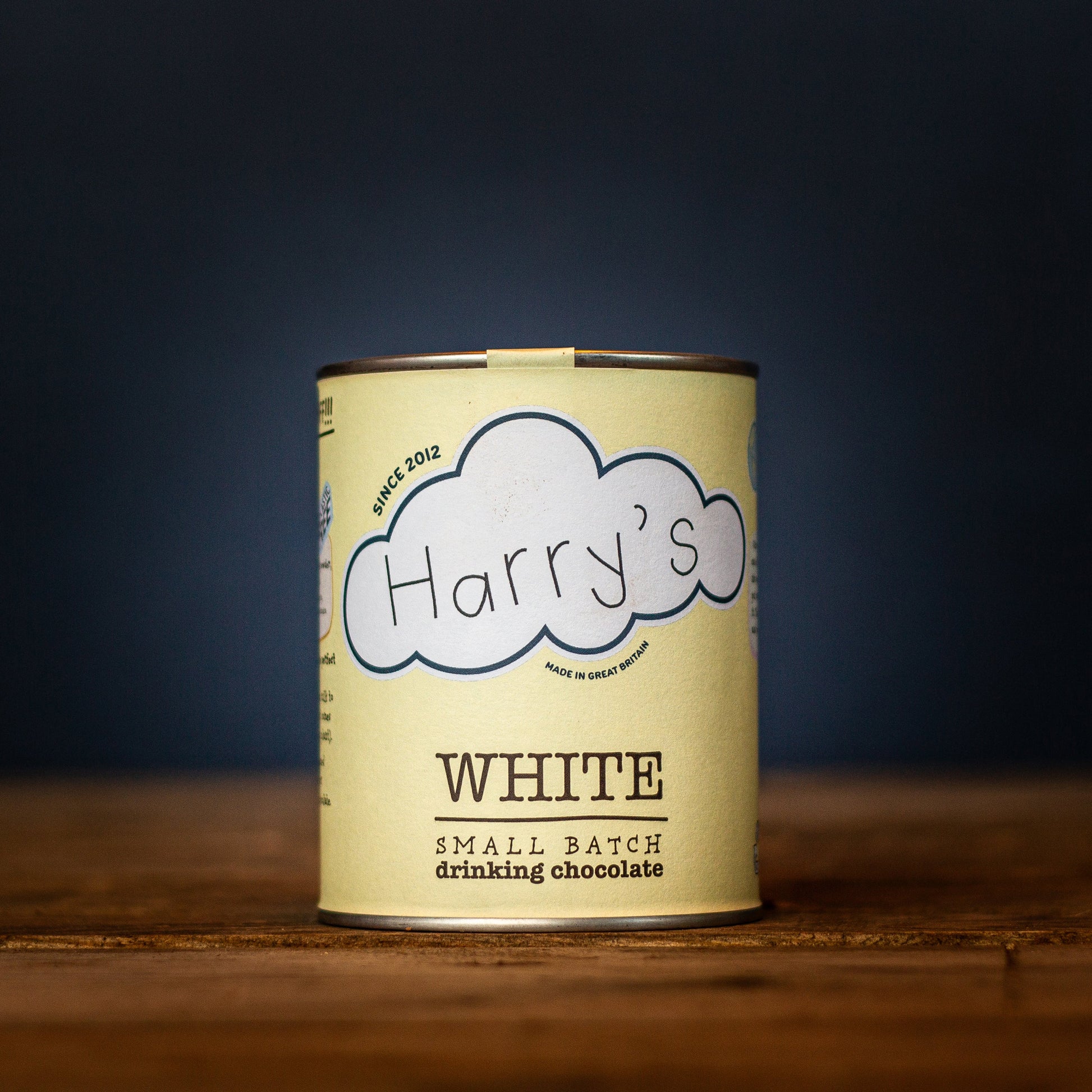 White 30% hot chocolate powder by Harry's Hot Chocolate, shown in a square package with a white design.