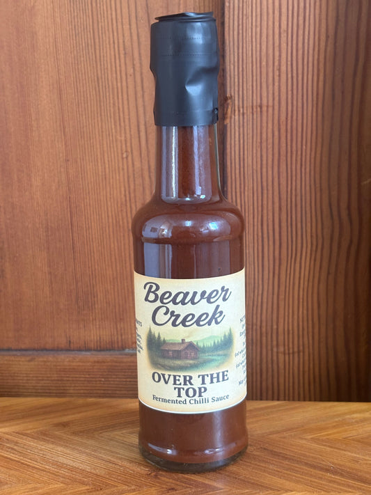 Beaver Creek BBQ Over the Top Fermented Chilli Hot Sauce bottle with label, showcasing medium spice level and vibrant chili image.