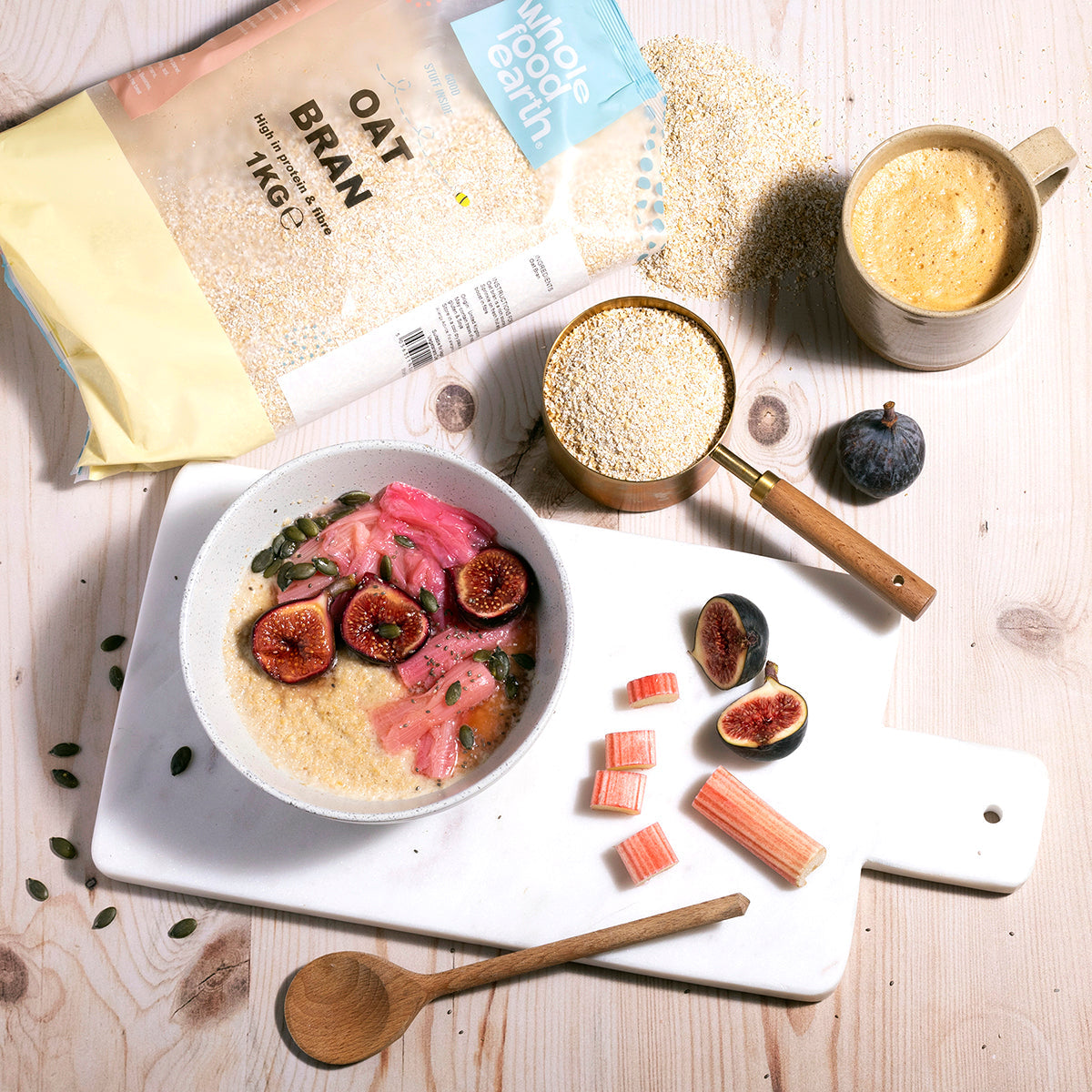 Whole Food Earth oat bran cereal in a bowl with milk and fresh fruit, showcasing a healthy breakfast option.