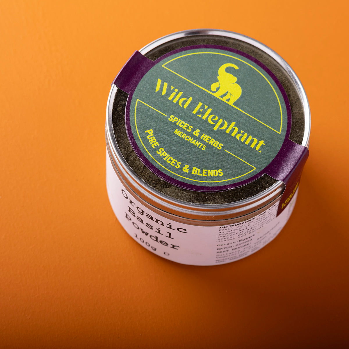 Organic basil powder by Wild Elephant in a 100g package; fine green herb used for cooking and seasoning.