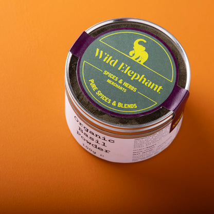 Organic basil powder by Wild Elephant in a 100g package; fine green herb used for cooking and seasoning.