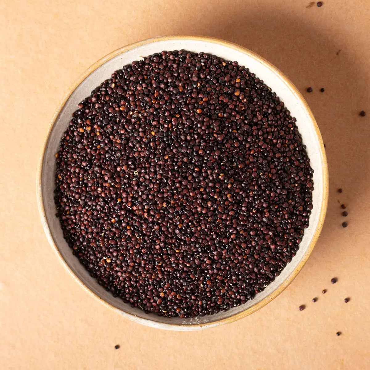 Organic black quinoa grains from Whole Food Earth, close-up of raw, organic black quinoa seeds in a bowl.