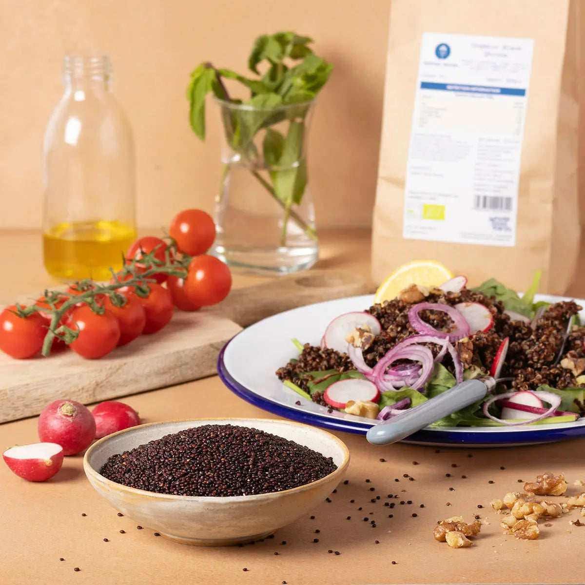 Organic black quinoa from Whole Food Earth, shown in a bowl with fresh vegetables on a rustic wooden table.