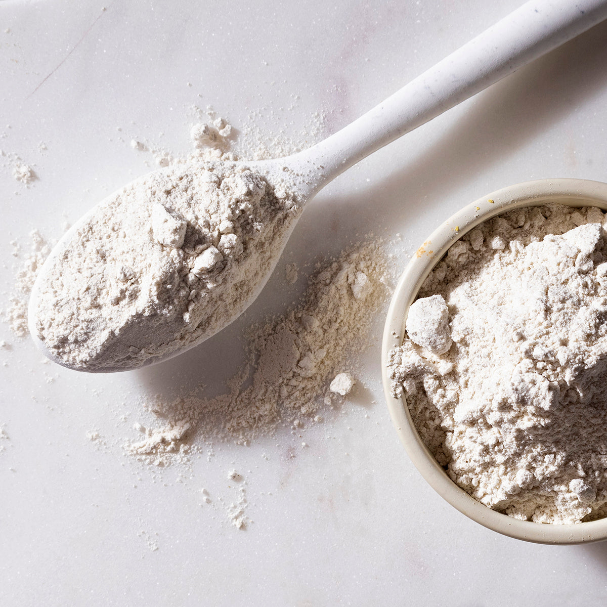 Organic buckwheat flour from Whole Food Earth, displayed in a bag, showcasing light brown, finely ground grain for baking and cooking.