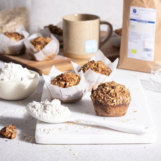 Organic buckwheat flour from Serious Grains in a natural setting, showcasing its light, powdery texture and organic packaging.