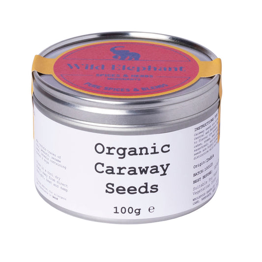 Organic Caraway Seeds from Whole Food Earth, 100g, showing small brown seeds in a clear glass jar on a white background.