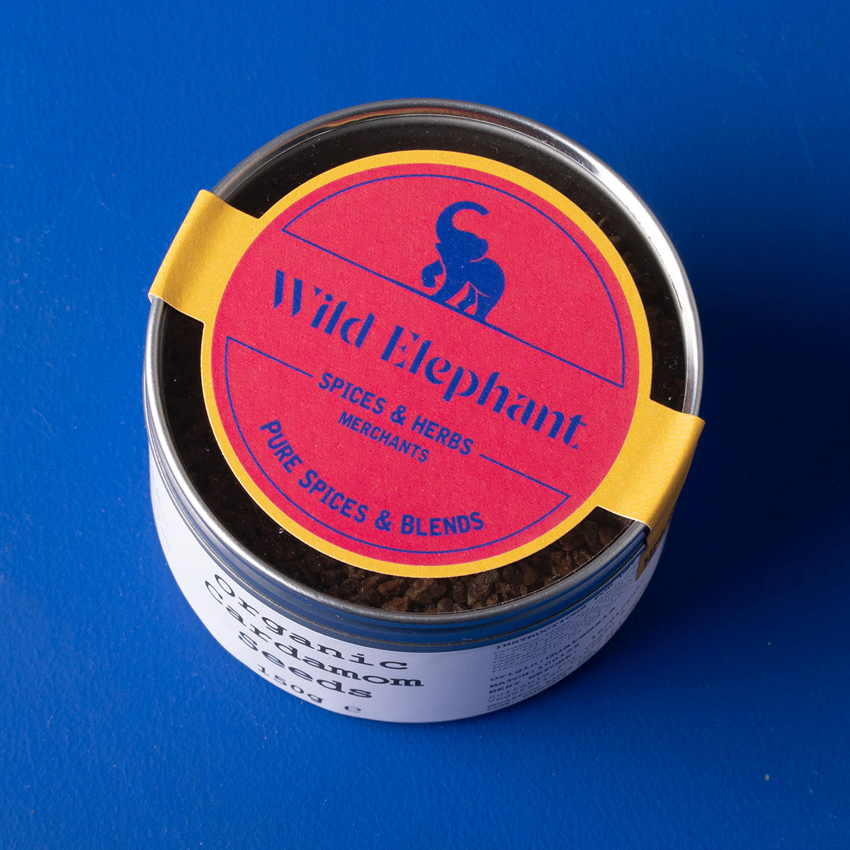 Organic cardamom seeds from Whole Food Earth, wild-harvested herbs and spices, shown in a 150g package.