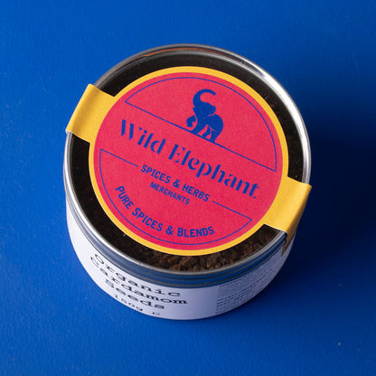 Organic cardamom seeds from Whole Food Earth, wild-harvested herbs and spices, shown in a 150g package.