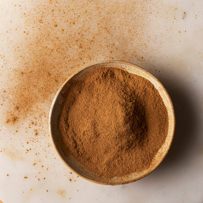 Organic Ceylon cinnamon powder from Whole Food Earth, fresh ground Ceylon cinnamon spice in a clear jar.