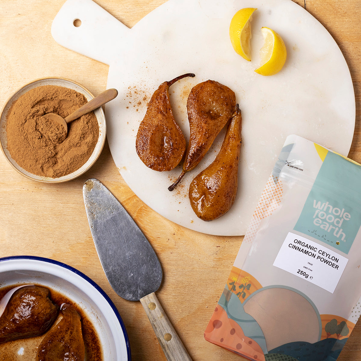 Organic Ceylon cinnamon powder from Whole Food Earth, shown in a clear jar with cinnamon sticks and spice filling.