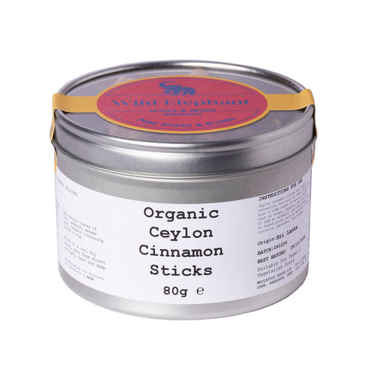 Organic Ceylon cinnamon sticks from Whole Food Earth, displayed in a clear container, showcasing their light brown, aromatic spice.