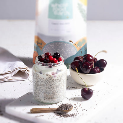 Whole Food Earth organic chia seeds in a bowl and on a spoon, showcasing the natural seeds in a lifestyle setting.