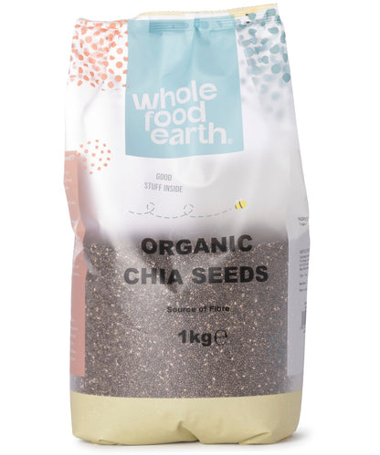 Organic chia seeds from Whole Food Earth in 1kg package, small pile of tiny black and white seeds on a white background.