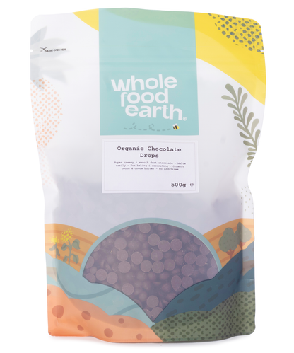 Organic chocolate drops from Whole Food Earth, 500g bag, close-up of glossy, dark chocolate candies for baking and snacking.