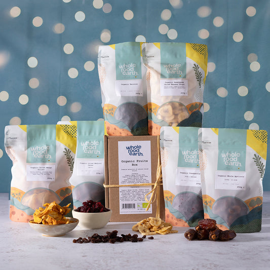 Organic Christmas Fruits Box from ArtisanBox showing fresh, seasonal organic fruits arranged in a festive display.