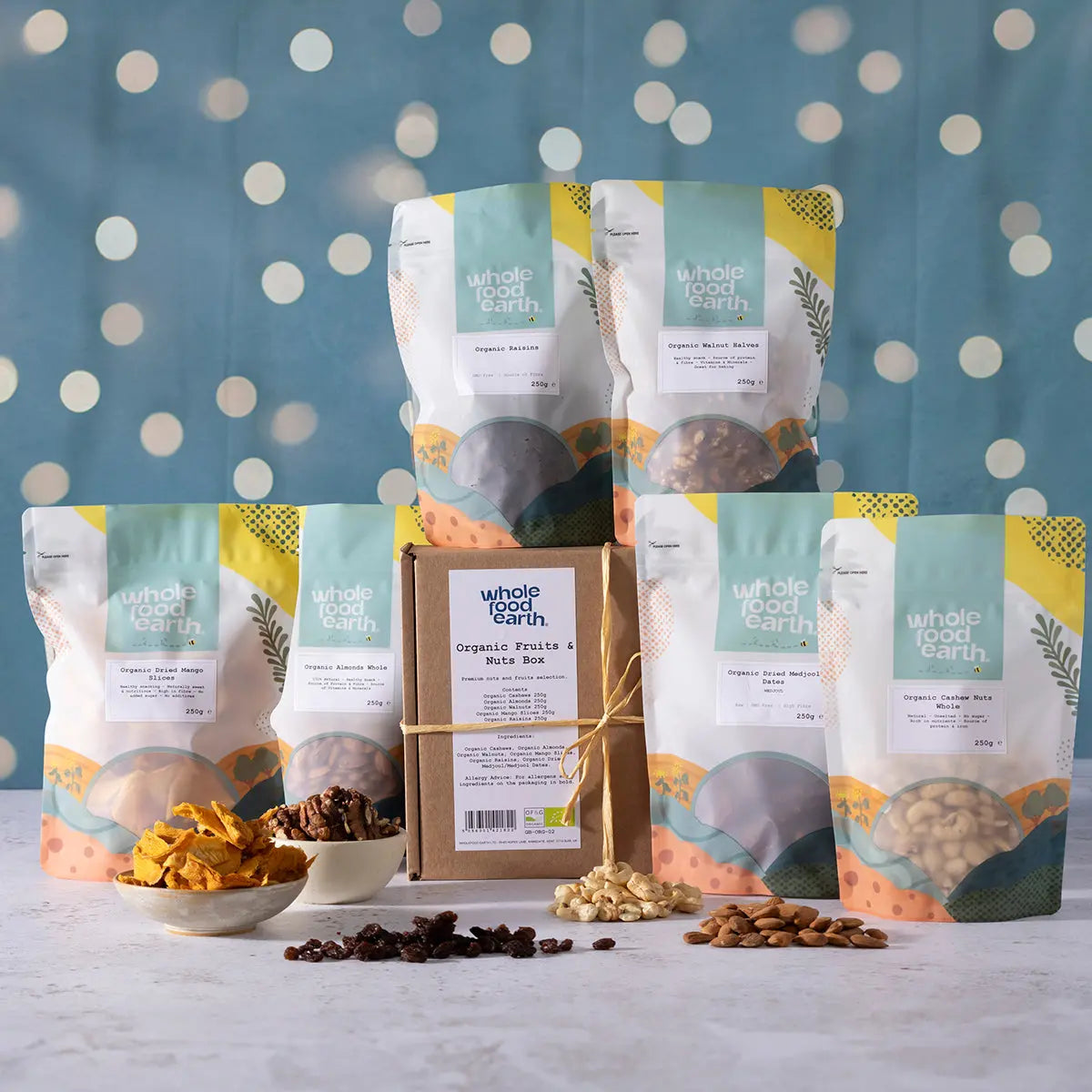 Organic Christmas fruits and nuts box by Whole Food Earth, featuring a variety of fresh fruits, nuts, and seeds in an attractive gift package.