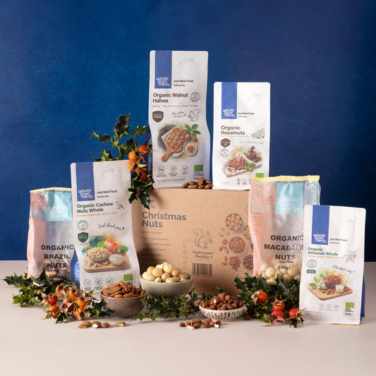 Organic Christmas Nuts Box from Whole Food Earth with a variety of nuts and seeds in festive packaging.