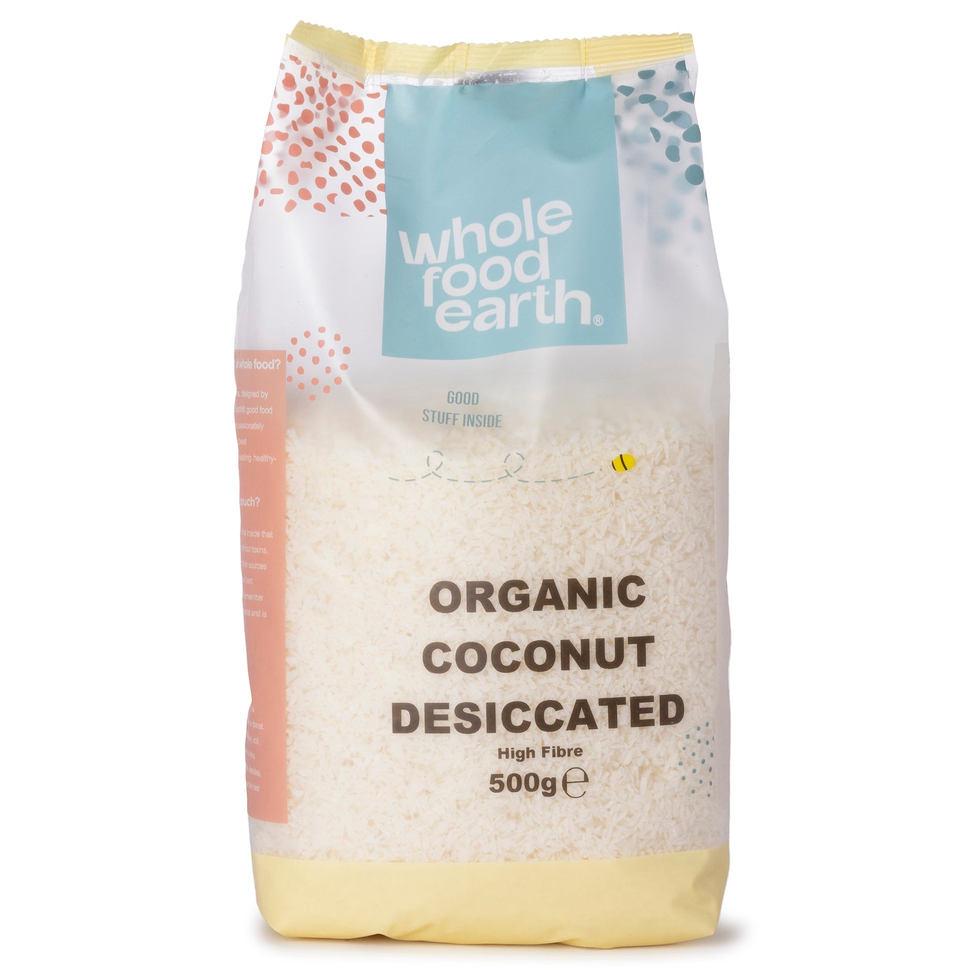 Organic Whole Food Earth coconut desiccated flakes in a 500g package, showcasing shredded dried coconut on a white background.