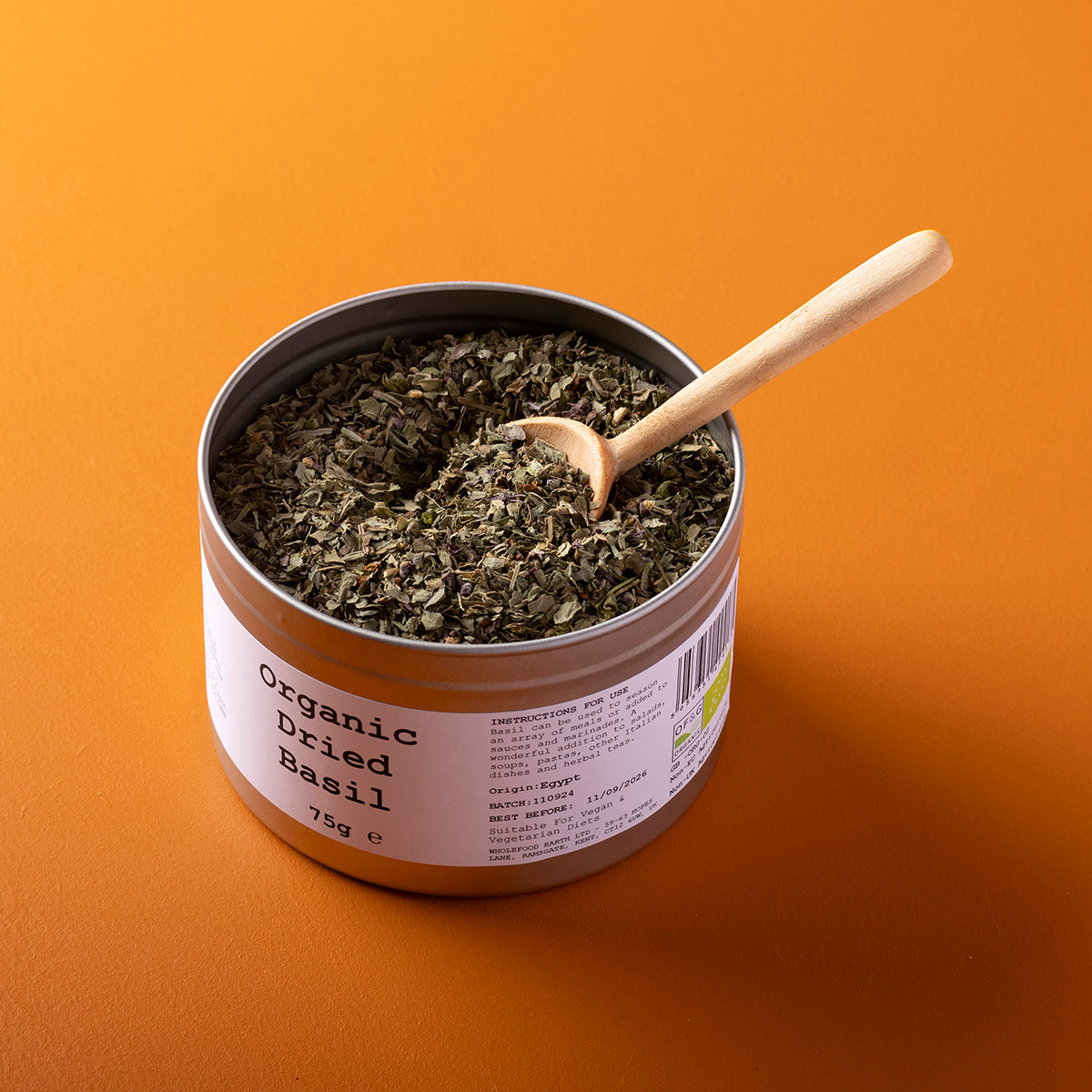 Organic dried basil leaves from Wild Elephant in a 75g package, showcasing fresh green herbs for cooking and seasoning.