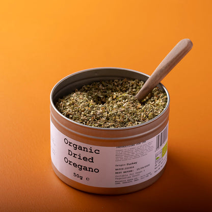 Organic dried oregano from Whole Food Earth, wild-harvested herb in a 50g package, showing dried green oregano leaves.