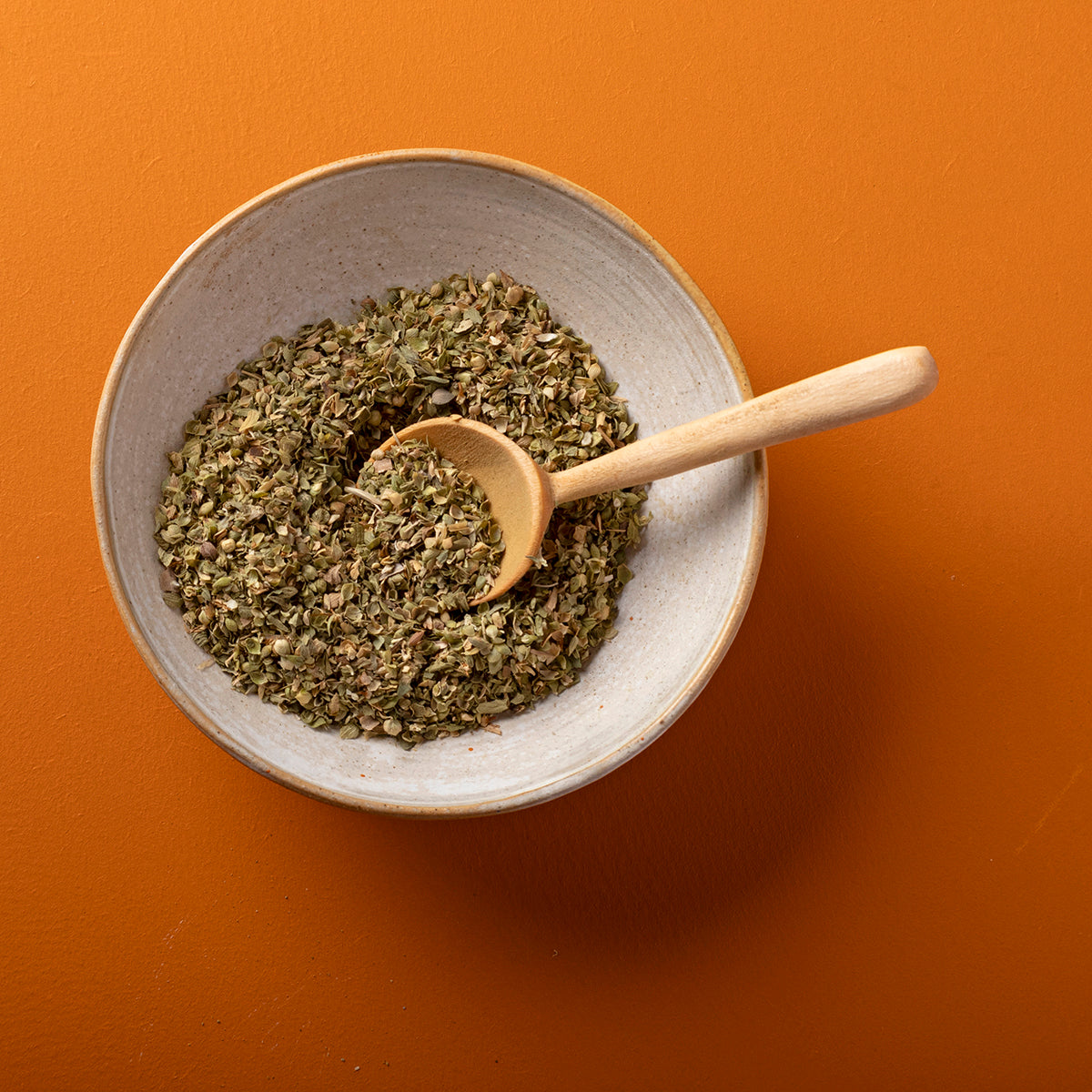 Organic dried oregano from Whole Food Earth, wild-harvested herb, 50g package, fresh green leaves for cooking and seasoning.