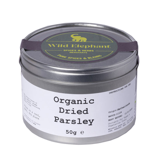 Whole Food Earth organic dried parsley from wild elephant, 50g, in a clear glass jar showing vibrant green herb leaves.