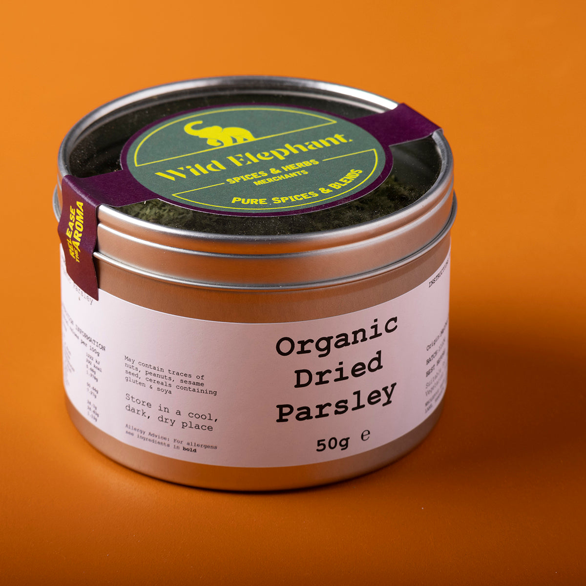 Organic dried parsley from Whole Food Earth, wild-harvested herbs and spices, shown in a 50g package.