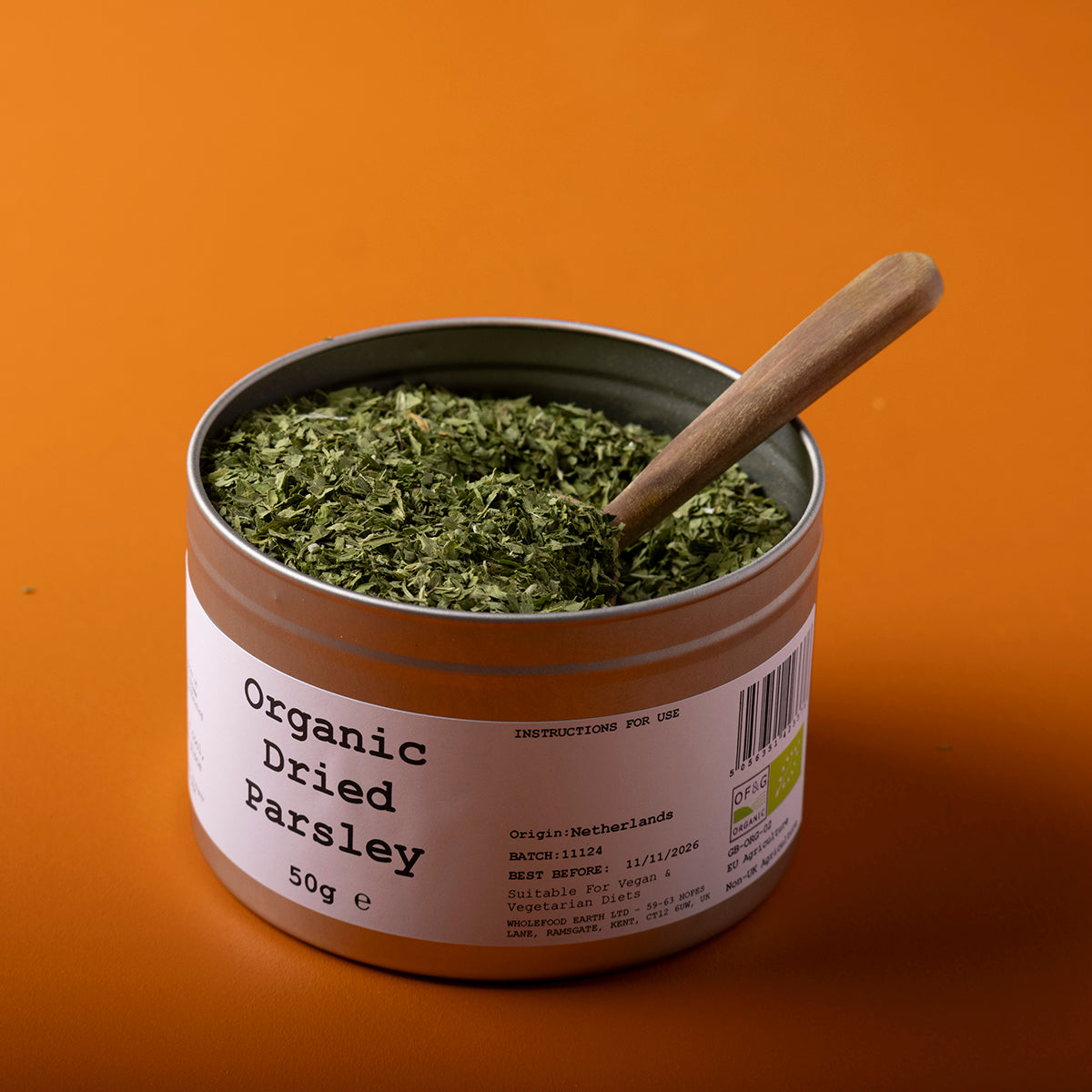 Organic dried parsley from Whole Food Earth, 50g, showing fresh green herb flakes ideal for cooking and seasoning.