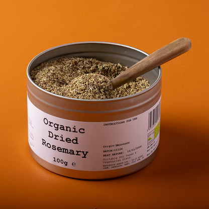 Organic dried rosemary from Whole Food Earth, showing fresh green needle-like herb in a 100g package, ideal for cooking and seasoning.