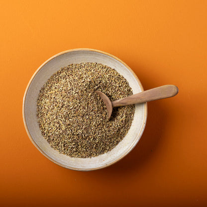 Organic dried rosemary from Whole Food Earth, showing fresh green herb with needle-like leaves in a 100g package.