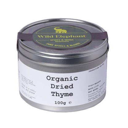 Organic dried thyme from Whole Food Earth, wild-harvested herbs and spices, 100g jar with fresh green thyme leaves.