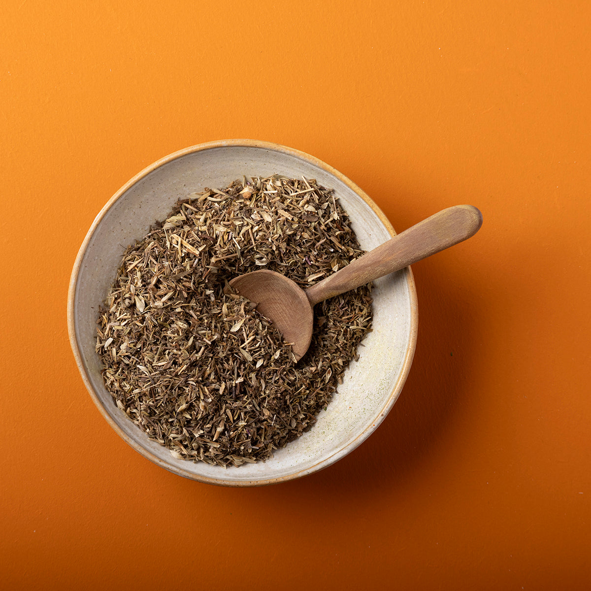 Organic dried thyme herb from Whole Food Earth, wild-harvested in 100g package, showcasing fresh green dried thyme leaves.