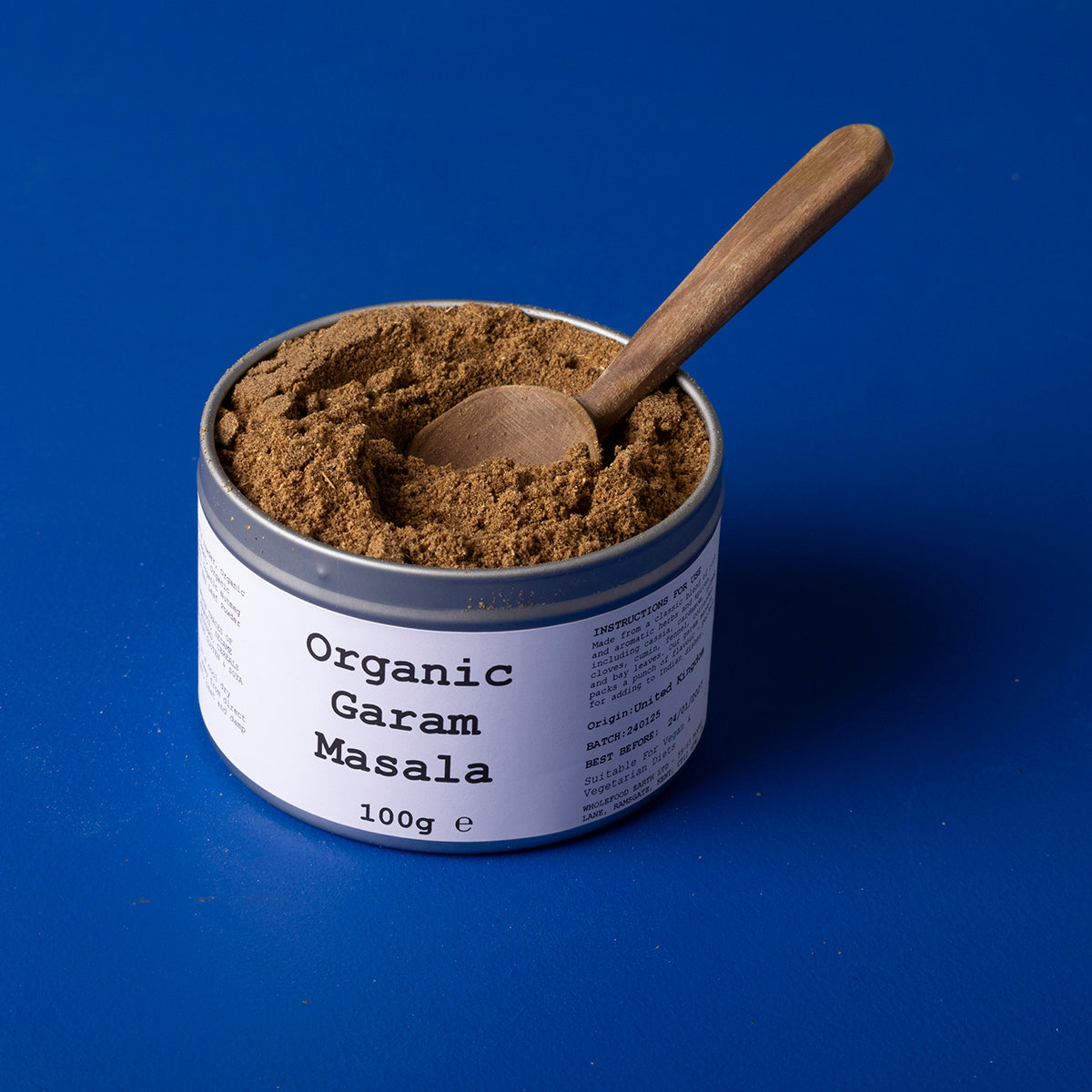 Organic Garam Masala spice blend from Wild Elephant, featuring a colorful mix of herbs and spices in a 100g package.