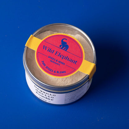Organic garlic powder by Whole Food Earth in a 200g package, showcasing a jar of finely ground garlic spice.