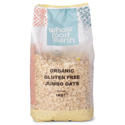 Organic gluten-free jumbo oats in a 1kg package by Whole Food Earth, showcasing large oat grains in a clear container.