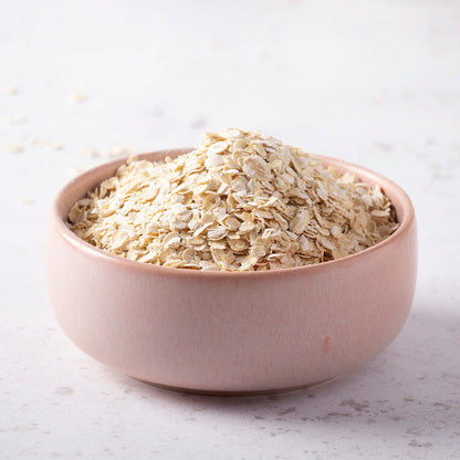 Organic gluten-free porridge oats from Whole Food Earth, close-up of uncooked oats in a bowl with fresh ingredients.