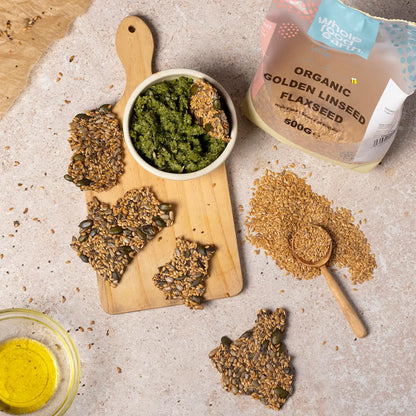 Organic Golden Linseed (flaxseed) in a jar, shown with whole flaxseeds and a spoon, highlighting Whole Food Earth's beans and pulses.