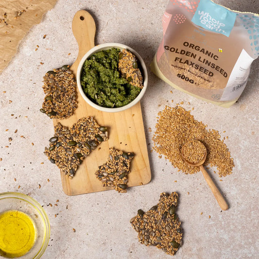 Organic Golden Linseed (flaxseed) in a jar, shown with whole flaxseeds and a spoon, highlighting Whole Food Earth's beans and pulses.