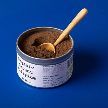 Organic ground allspice from Wild Elephant, a 100g jar of Whole Food Earth herbs and spices, showing the spice in a clear jar.