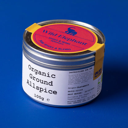 Organic ground allspice from Whole Food Earth, herbal spice in a 100g package, shown in a clear image.