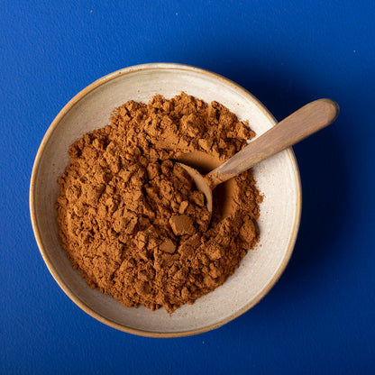 Organic ground cinnamon cassia from Wild Elephant, a natural spice in a glass jar, ideal for baking and cooking.