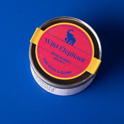 Organic ground cloves from Wild Elephant, 100g, in a glass jar, showcasing rich brown spice and fresh herb appearance.