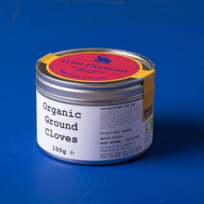 Organic ground cloves from Wild Elephant in a 100g package, showcasing the rich, aromatic spice in a clear bag.