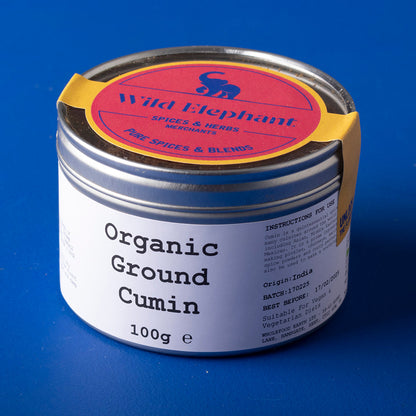 Organic ground cumin from Wild Elephant in a 100g package, showcasing the spice's rich brown powder in a clear container.