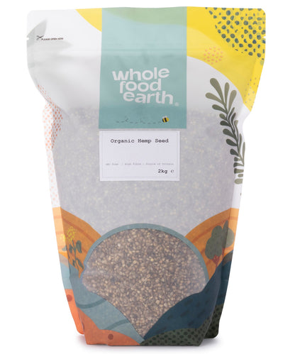 Organic hemp seeds in a 2kg bag from Whole Food Earth, showing small beige seeds in a clear plastic bag.
