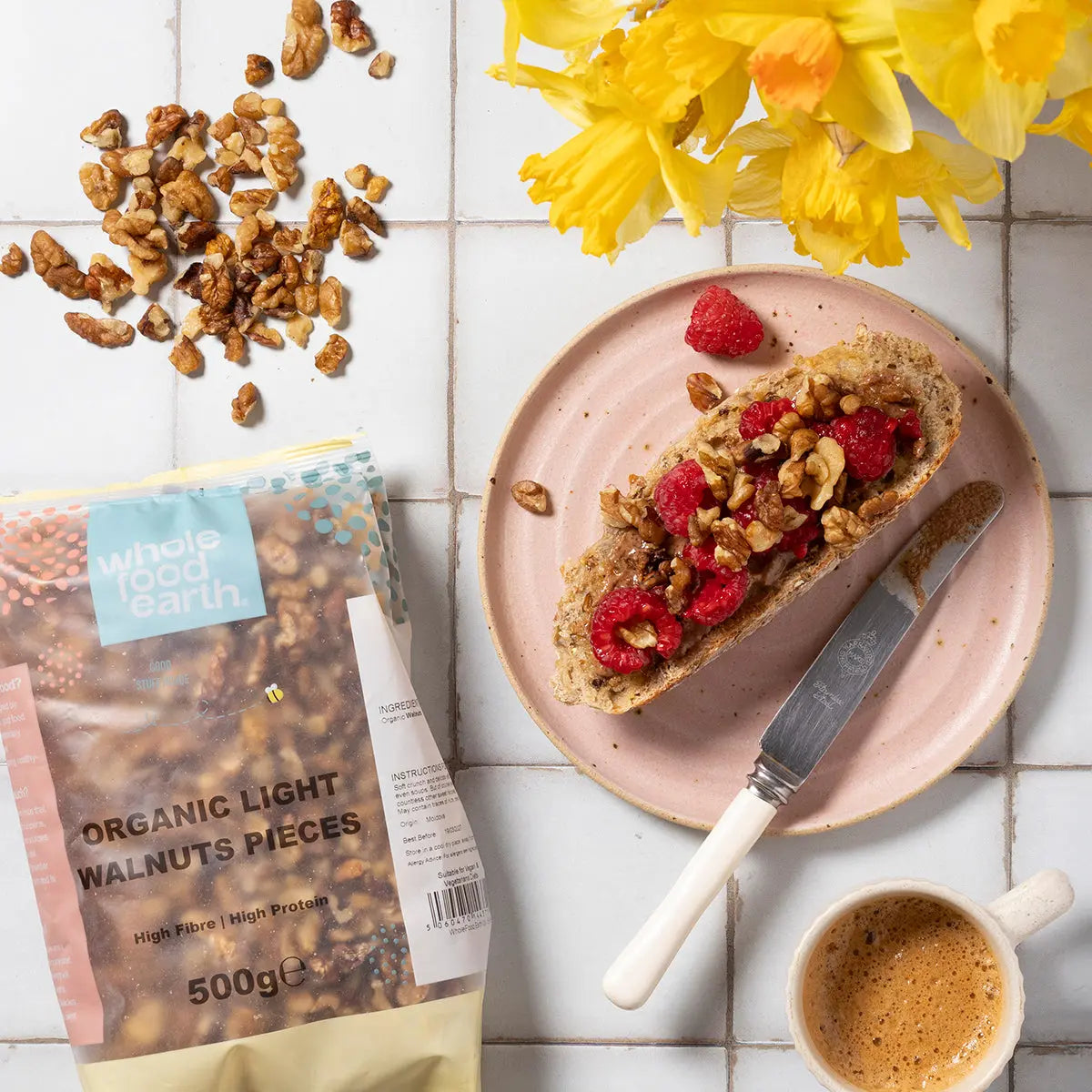 Organic light walnut pieces from Whole Food Earth, showing shelled walnuts in a natural, organic nuts and seeds display.