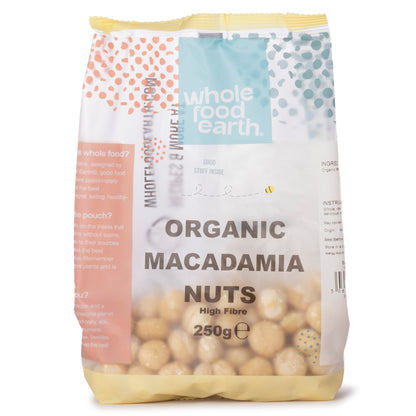 Organic macadamia nuts in a 250g package from Whole Food Earth, showcasing whole, crunchy nuts in a natural setting.