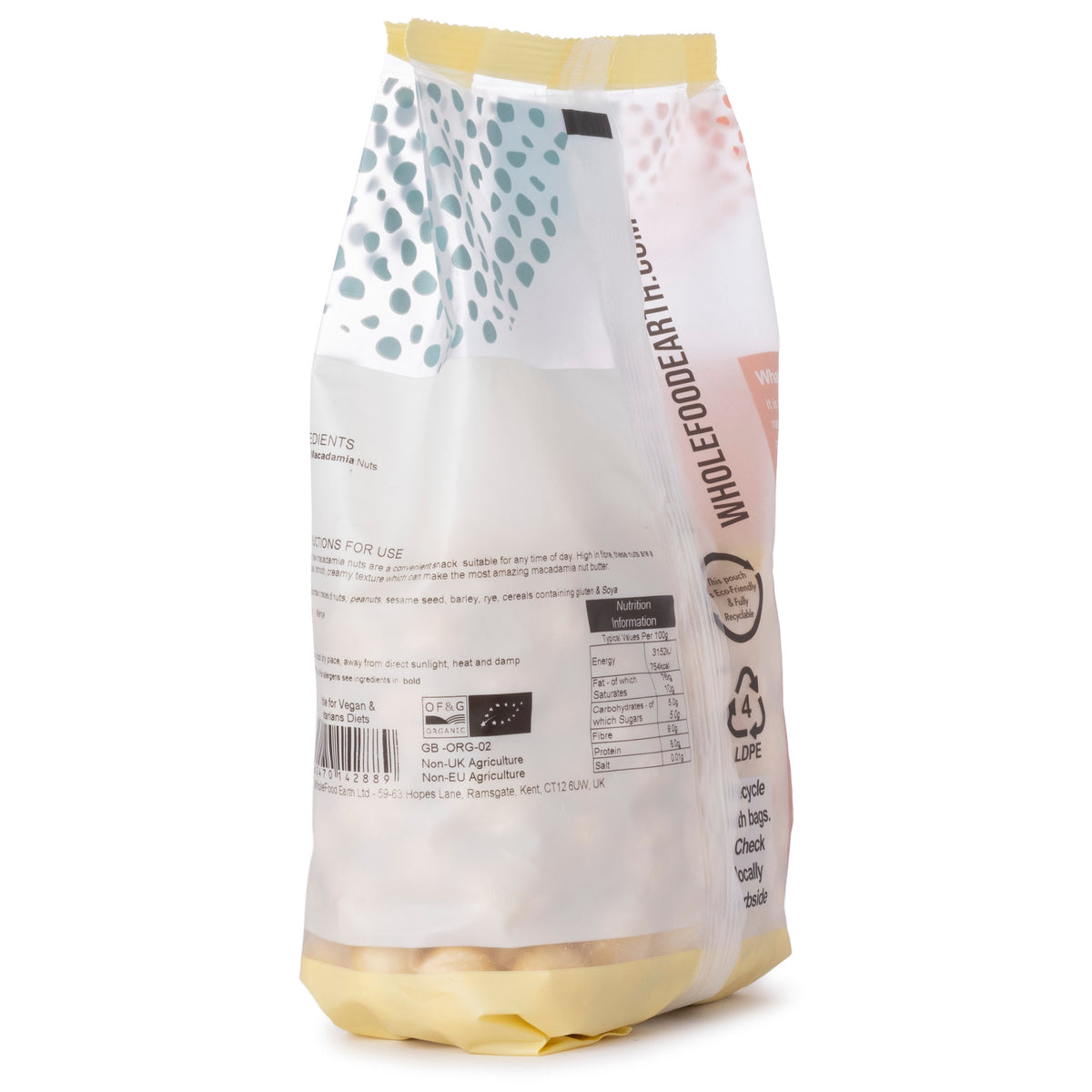 Organic macadamia nuts from Whole Food Earth, whole and shelled, displayed in a clear bowl on a neutral background.