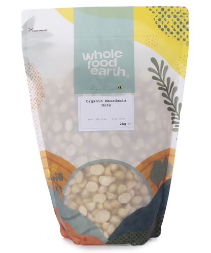 Whole Food Earth organic macadamia nuts in 2kg bag, showcasing whole, raw nuts with textured brown shells and creamy interior.
