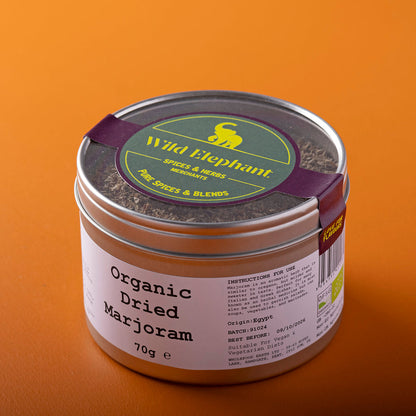 Organic dried marjoram herb from Whole Food Earth, wild-harvested, in a 70g package, shown in a clear image.